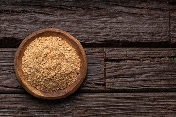 Soy fiber based powdered food in the bowl - Rustic wooden background