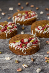 Homemade cookie with raspberry and pistachio gray background