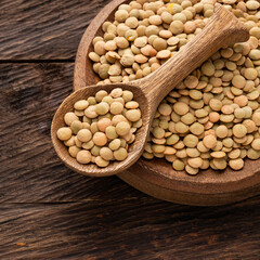 Lens culinaris - Brown lentils in bowl and spoon.