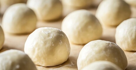 Fototapeta premium The proofing process of dough before baking. Preparation of whole grain hamburger buns.
