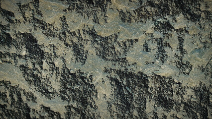 Textured natural stone pattern in gray and black hues with rugged details, perfect for realistic backgrounds, wallpapers, and design templates