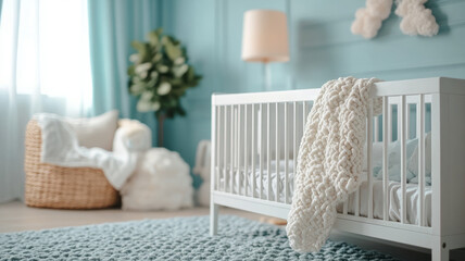 White crib in a serene blue nursery with cozy decor.