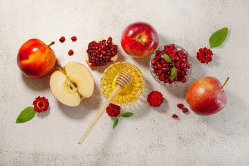 Rosh Hashanah is a Jew New Year. Apple, honey, pomegranate for the festive table. Happy Rosh Hashanah. Shana Tova