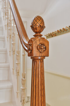 Classic wooden newel post on staircase