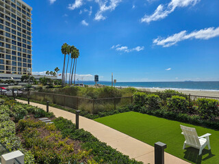 Fototapeta premium a gorgeous landscape at Coronado Beach with blue ocean water, white sand, blue sky and clouds at Hotel del Coronado in Coronado California USA