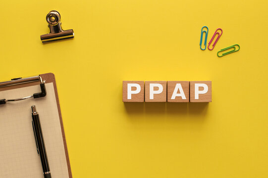 There is wood cube with the word PPAP. It is an abbreviation for PPAP as eye-catching image.