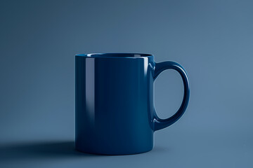 Obraz premium A sleek, glossy blue mug stands alone against a minimalist blue background, exuding a calm and modern aesthetic.