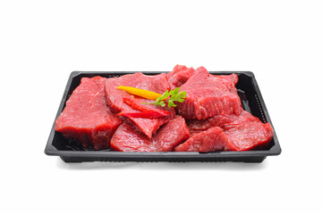 Fresh Raw Beef Steaks in Black Tray with Garnish Isolated on White Background