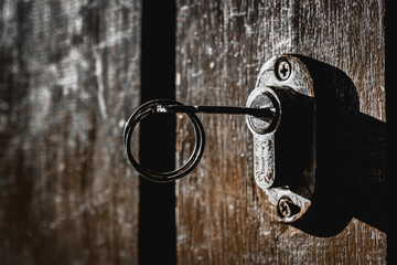 The key hanging on the wooden door