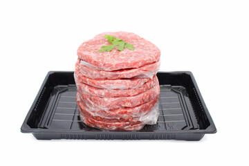 Stack of Fresh Raw Beef Burger Patties in Black Tray Isolated on White Background
