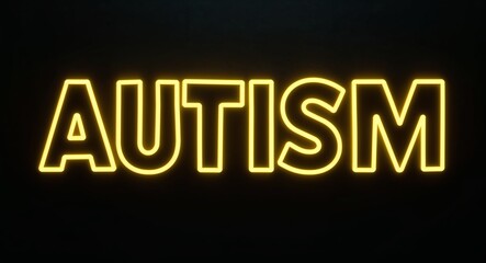 autism word lettering with yellow glow on plain black dark background