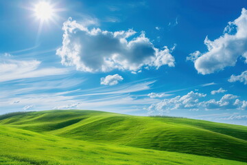 Fototapeta premium Smooth meadow on the hill with blue sky, beautiful landscape