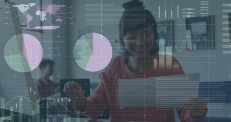 Image of financial data processing over caucasian businesswoman in office