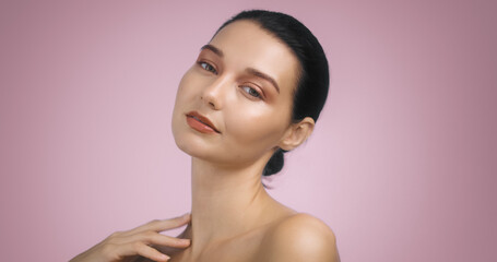 Elegant Brunette Woman with Bright Evening Makeup on Pink Background