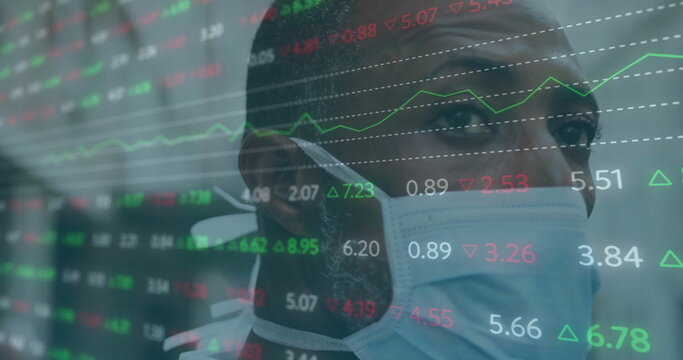 Image of financial data processing over african american man in face mask in city