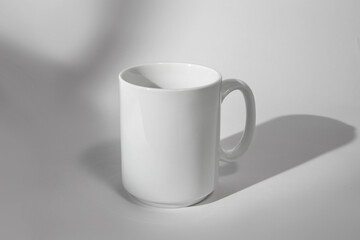 White coffee mug isolated on white background with shadow