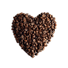 Fresh coffee beans arranged in the shape of a heart.