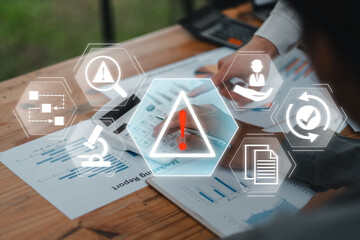 Digital icons representing incident management over business reports on a desk, highlighting risk...