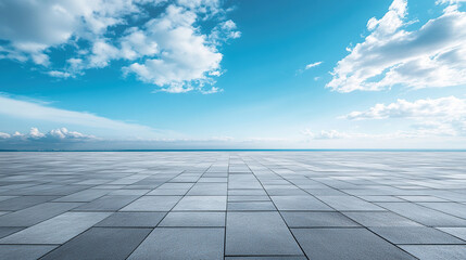 An empty square SLATE pavement with a blue sky as the background