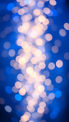Fototapeta premium Festive Glow: Blue and Gold Abstract Bokeh for New Year's Eve