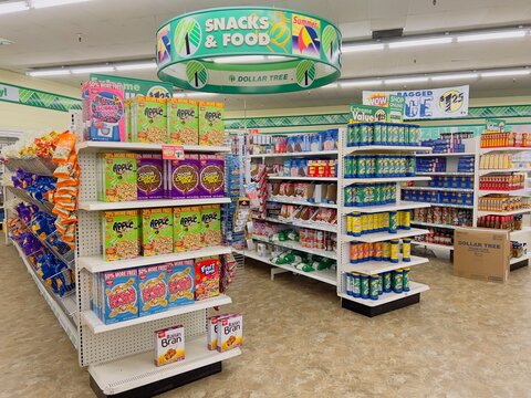 Dollar Tree Store interior. Full shelves of snacks and food items.
