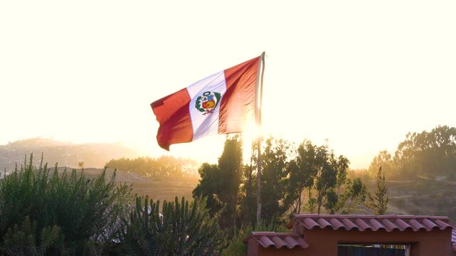 Peruvian flag flying in the city of Cusco