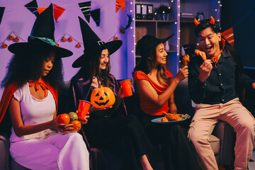 Joyful office Halloween party with coworkers in costumes, celebrating with drinks and laughter, fostering teamwork and festive spirit
