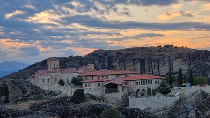 Fototapeta premium meteora churches in kalampaka city greece sunset time