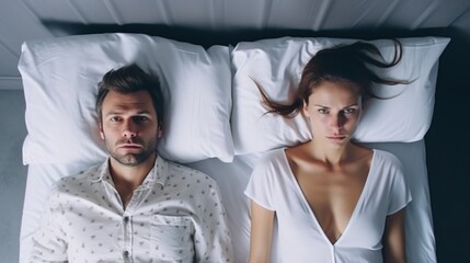 Unhappy couple lying in bed with crossed arms, staring into the distance, conveying tension and marital dissatisfaction.