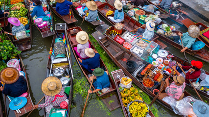 Aerial view Damnoen Saduak floating market, Farmer go to sell organic product, fruit, vegetable and...