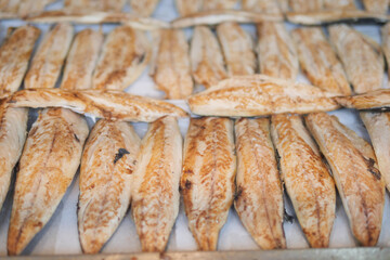 A beautifully presented platter featuring freshly grilled fish as the main attraction