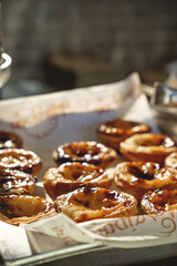 Fresh baked Pastel de nata or Pastel de belém .The most famous sweet in Portugal. Tart on baking...