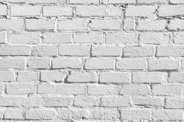 Fototapeta premium A gray brick wall. The texture of old bricks. Horizontal image of brickwork.