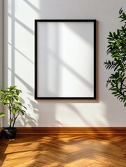 A minimalist interior with a blank picture frame, natural light streaming through a window, casting shadows on the white wall, and a warm wood floor. The scene offers a clean and inviting backdrop, pe