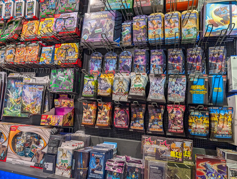 France, 19 August 2024: Display of trading card game products in a retail store.