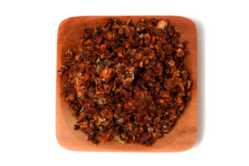 Chili oil sambal made from dried bird’s eye chilies, garlic, spices, herbs, kaffir lime leaves, and oil, photographed on a white background. A perfect companion for adding bold, delicious heat to any 