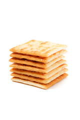 A stack of sweet crispy cracker sprinkled with sugar on top, set against a clean white background. The golden brown crackers create a simple yet appetizing display
