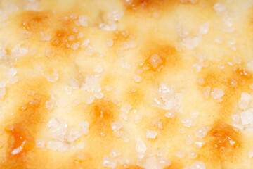 Sweet crispy cracker sprinkled with sugar on top, set against a clean white background. The golden brown crackers create a simple yet appetizing display