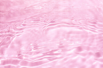 Pink Water with Gentle Ripples. Blurred Transparent Pink Surface Texture Featuring Bubbles and...