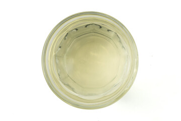 Liquid Lard in clear glass isolated on white background with clipping path top view flat lay stack.