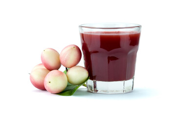 Group of fresh Bengal-currants, Carandas-plum, Karanda and juice in clear glass, isolated on white background with clipping path. Top view. Flat lay.