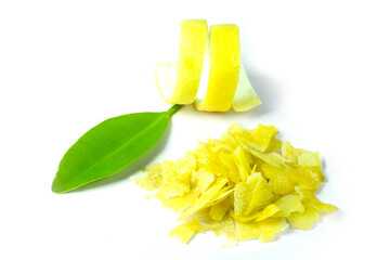 Lemon zest both twist and cut with green leaf isolated on white background close up stacking.