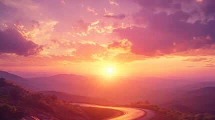 Fototapeta premium A winding road leads through a picturesque landscape at sunset, showcasing vibrant colors.