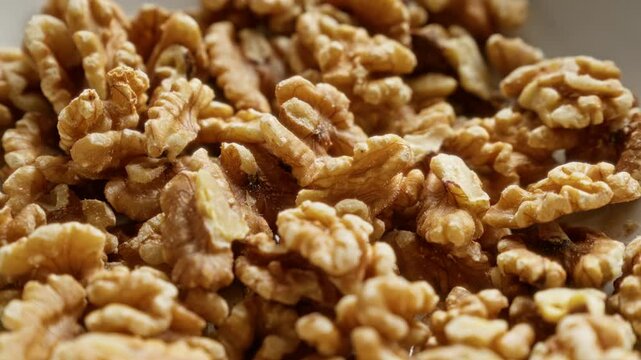 Piles of shelled walnuts depicting healthy, natural, organic, fresh, tasty, wholesome, nutritious, delicious, raw, and crunchy nuts