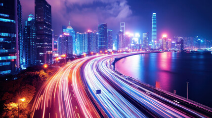 Obraz premium vibrant cityscape at night showcases illuminated skyscrapers and flowing traffic along curved road, reflecting dynamic energy of urban life