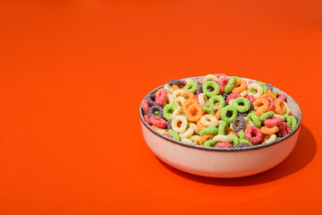 Colorful cornflakes, concept of tasty breakfast, morning food, space for text