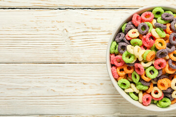 Colorful cornflakes, concept of tasty breakfast, morning food, space for text