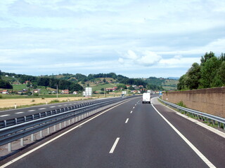 A view from the car window at the sky, which is quickly covered by a carpet of clouds.