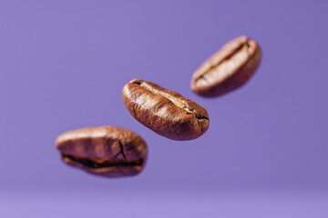 Obraz premium Levitating coffee beans flying above on orange studio background. Invigorating morning, motivation to start the day concept