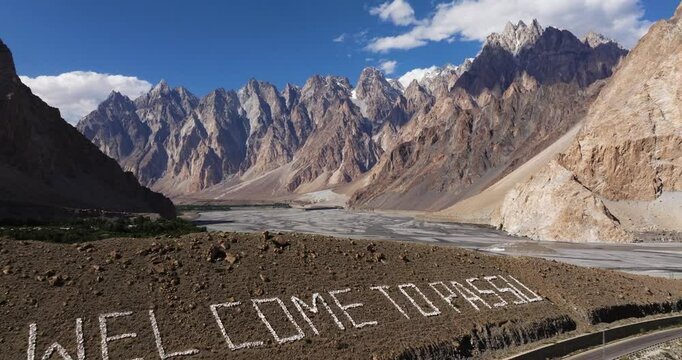 Establishing Drone Shot Above Passu Cones, Karakoram Highway, Pakistan. Summer. Welcome to Passu Mountains